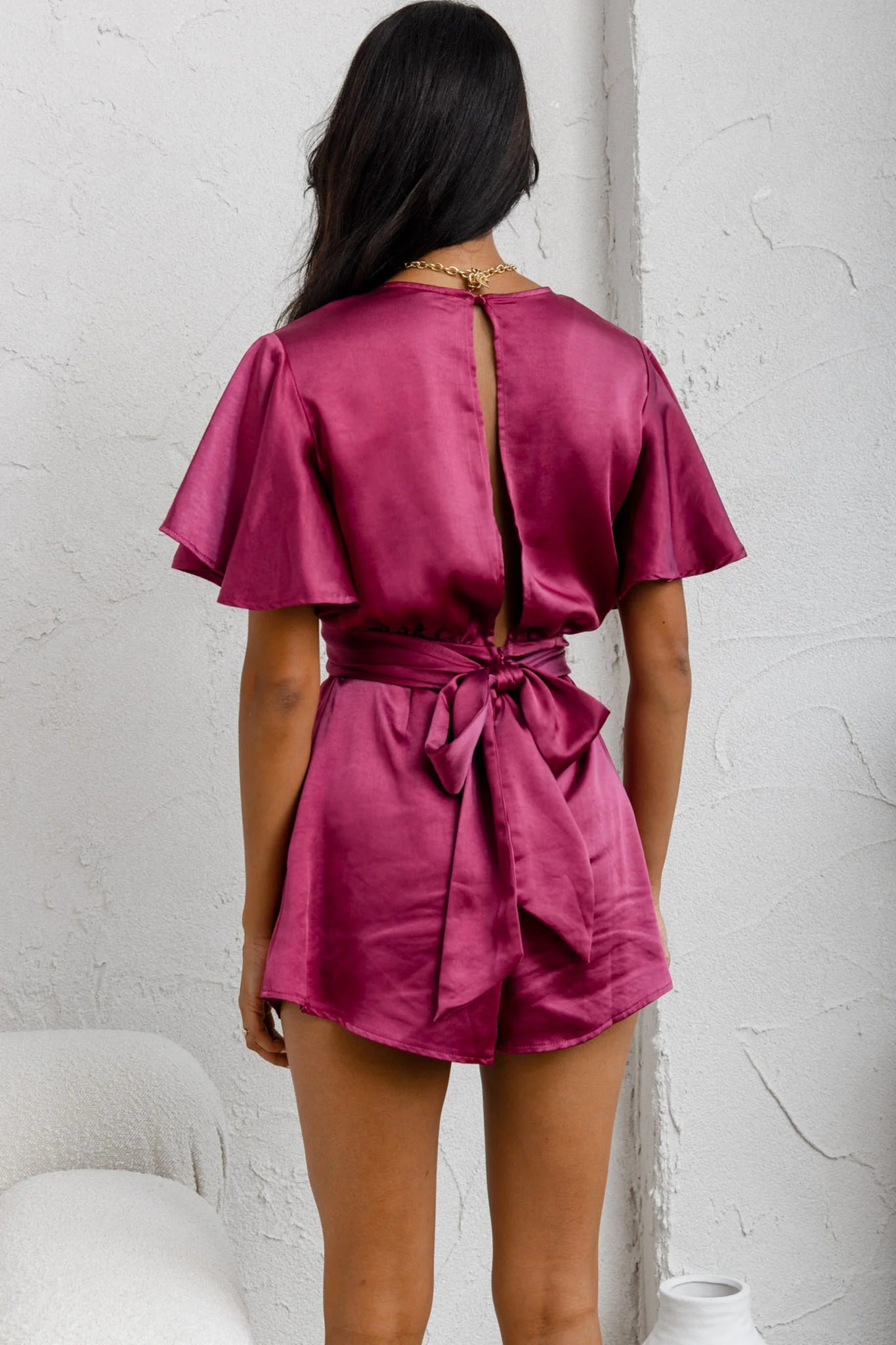 Unconditional Plunging Wrap Style Romper Fuchsia